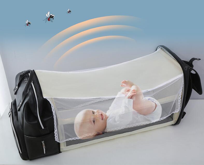 Sac à dos à couches multifonctionnel en cuir PU élégant avec lit bébé